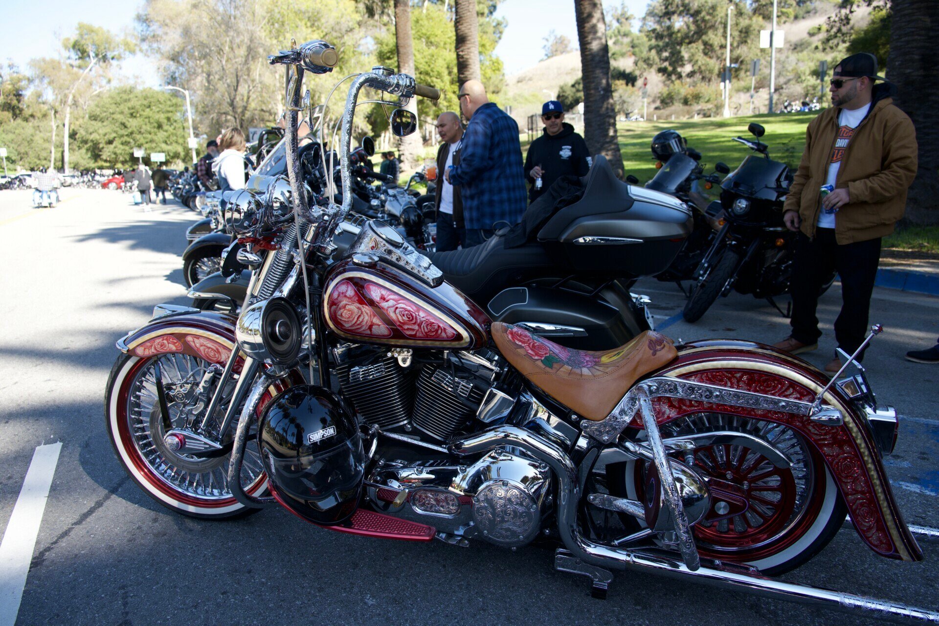 Custom-designed chopper motorcycle with intricate patterns and chrome detailing showcased at Elysian Park, LA