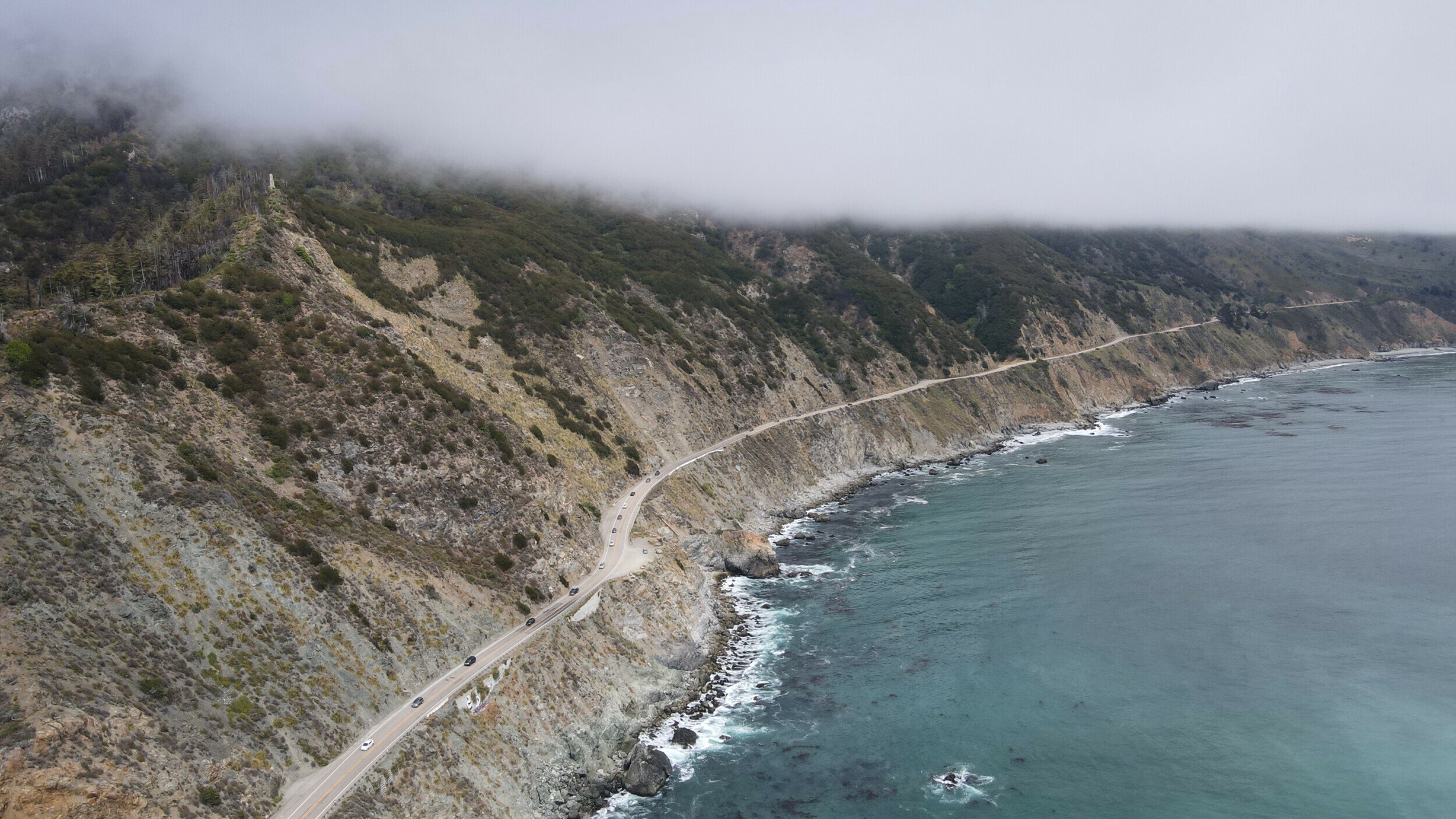 Aerial view of Highway 1 snaking along the rugged Big Sur coastline near the Limekiln Park.